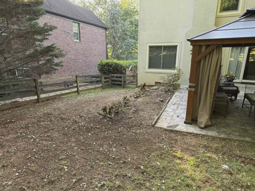 Residential backyard cleared and opened up after complete tree and shrub removal near gazebo and patio – White's Tree Service Knoxville TN